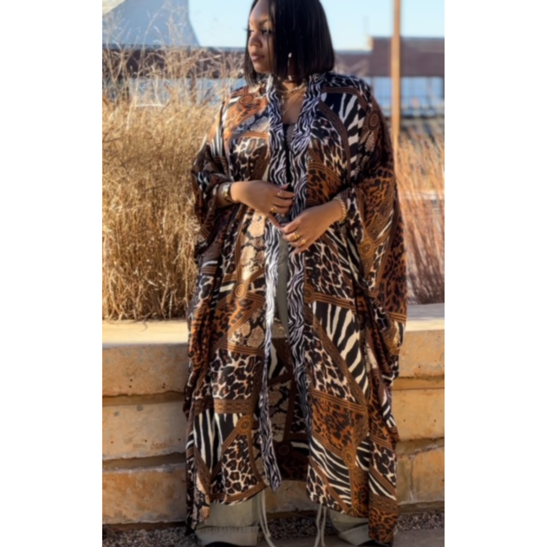 model wearing the LJ Safari Serenity Kaftan Kimono, emphasizing the vibrant safari print and elegant drape