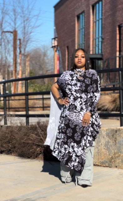 LJ Jungle Couture Asymmetrical Blouse showcasing bold animal print and flattering asymmetrical cut.