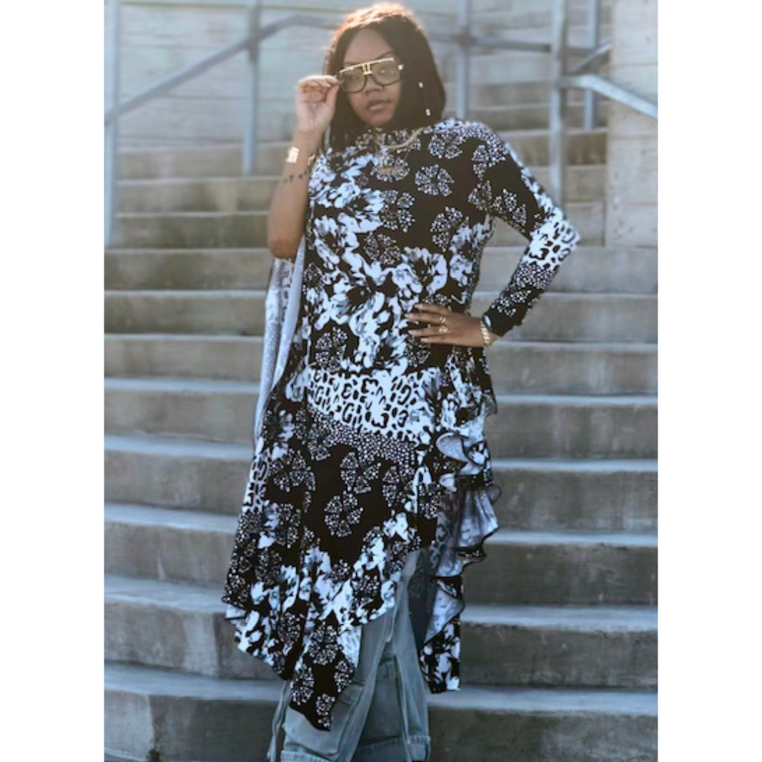 Model wearing the LJ Jungle Couture Asymmetrical Blouse in a chic setting, illustrating its stylish design and high-quality fabric.