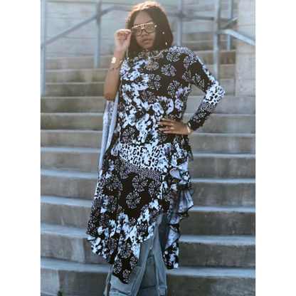 Model wearing the LJ Jungle Couture Asymmetrical Blouse in a chic setting, illustrating its stylish design and high-quality fabric.